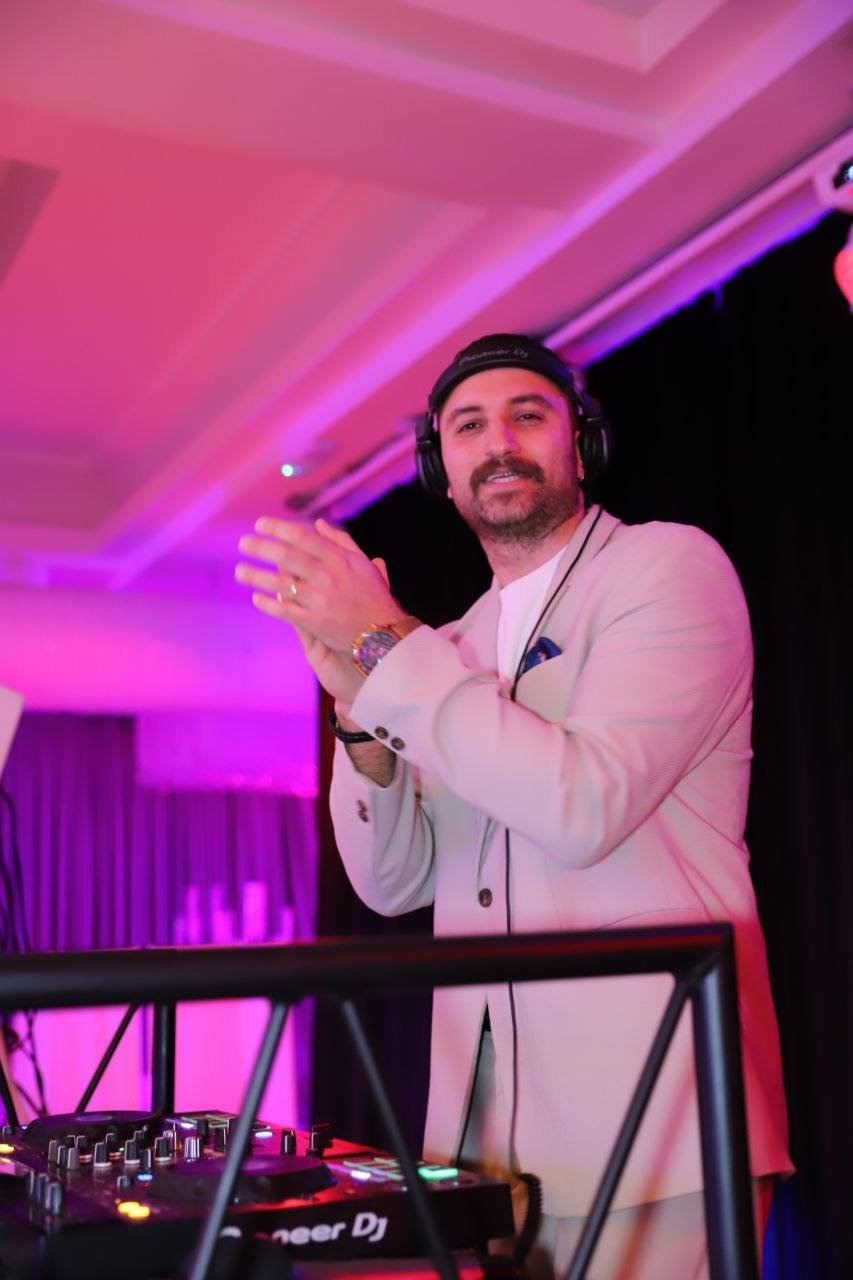 DJ Masoudi playing at a wedding reception